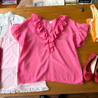 pink frill blouse