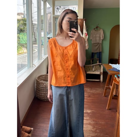 orange sleeveless tops
