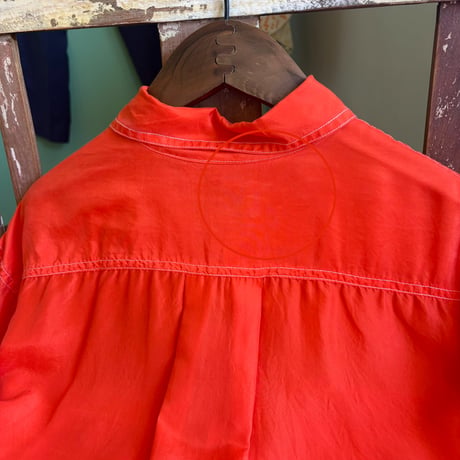 orange silk shirt