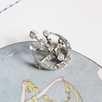 crescent and fireworks brooch