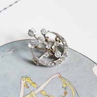 crescent and fireworks brooch