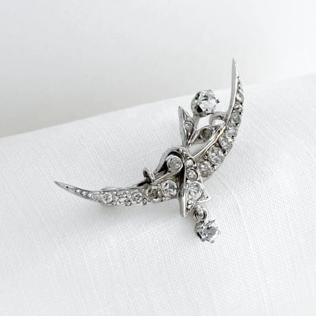 crescent and flower brooch