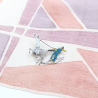 horse and skier brooch