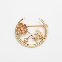crescent brooch *flower