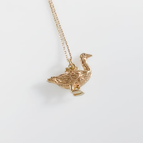 golden goose with an egg pendant