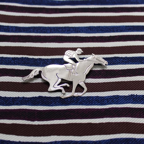 jockey brooch