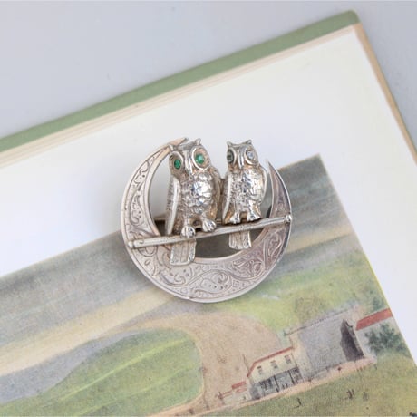 owls on engraved crescent brooch
