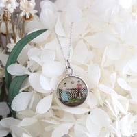 reverse carved and painted tennis match pendant