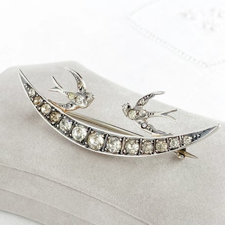 crescent and double swallow brooch