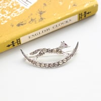 crescent and jumping fox brooch