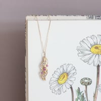 wave pendant *9ct+10ct gold, pink sapphire and pearl