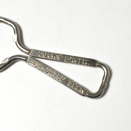 USED "LUCKEY LAGER" AGE-DATED BEER BOTTLE OPENER