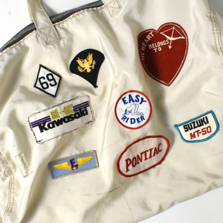 USED UNKNOWN PATCHED NYLON DUFFLE BAG
