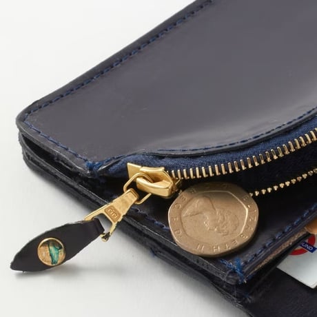 ROUND LONG PURSE / EMBOSSED LEATHER