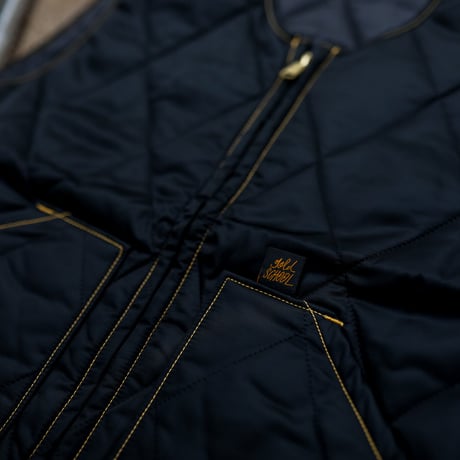gold school vest