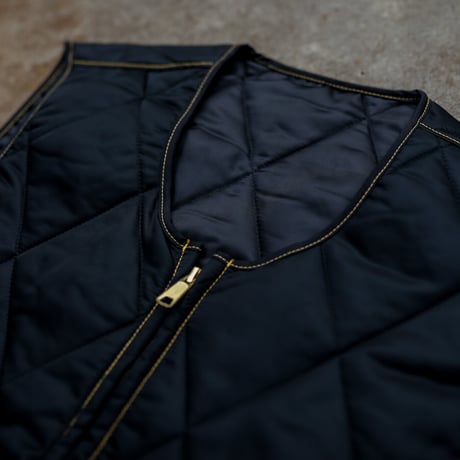 gold school vest
