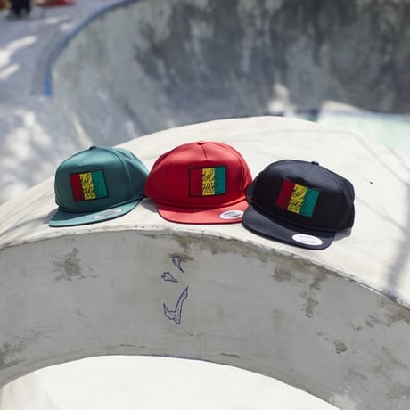 gold school rasta cap