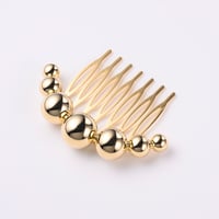 Sphere comb / gold color