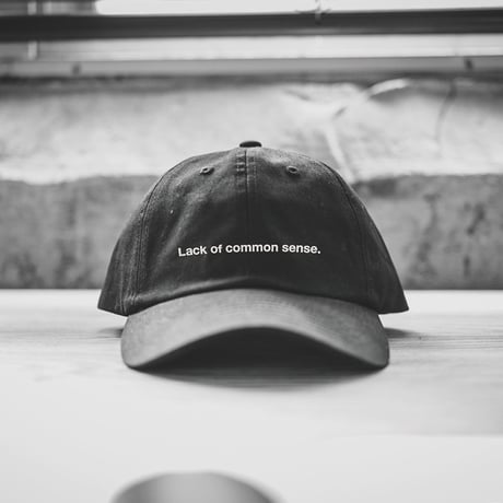 Lack of common sense Horizontal Logo  cap