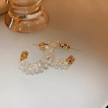 clear × gold hoop pierce