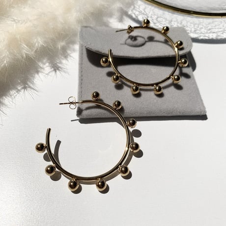 simple gold bowl big hoop pierce