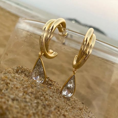 gold hoop × clear drop pierce