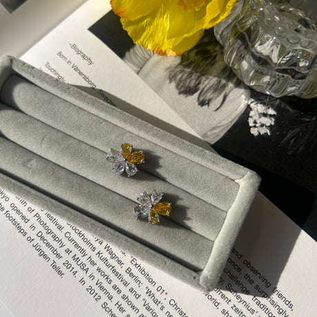 clear × yellow flower pierce