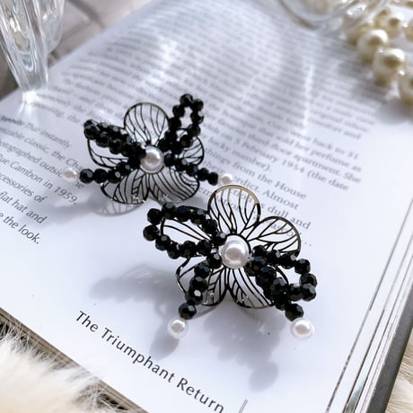 black flower × ribbon pierce