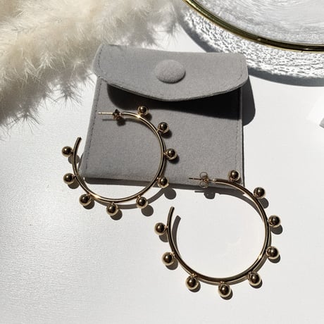 simple gold bowl big hoop pierce