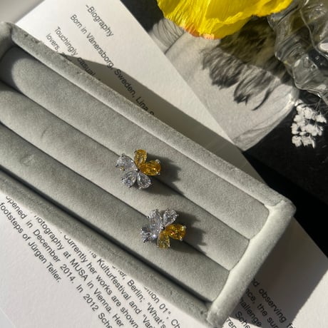 clear × yellow flower pierce