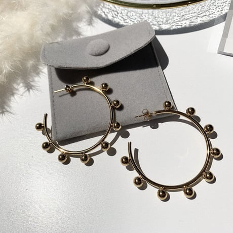 simple gold bowl big hoop pierce
