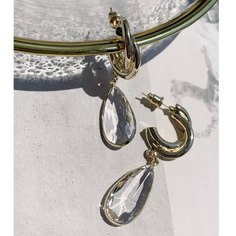 gold hoop × clear drop pierce