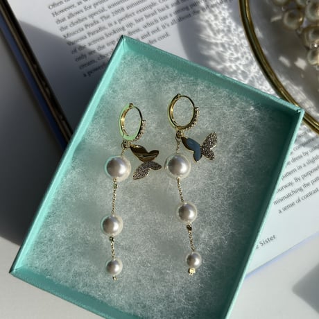 butterfly × pearl long loop pierce