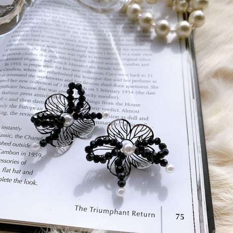black flower × ribbon pierce