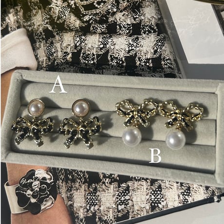 black ribbon × pearl pierce