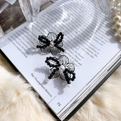 black flower × ribbon pierce