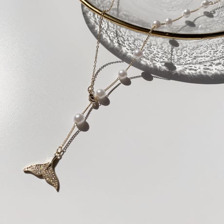 tail × pearl necklace