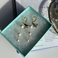 butterfly × pearl long loop pierce