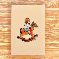25K-57: "Boy riding a rocking horse"  postcard