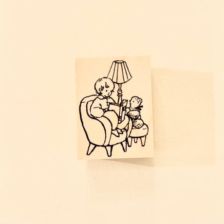 No. 255 "Reading on Sofa" rubber stamp