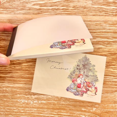 "Three kids opening gifts" memo pad メモ帳