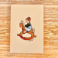 25K-56: "Girl riding a rocking horse"  postcard