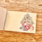 \"Three kids opening gifts\" memo pad メモ帳