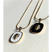 Milanese designer's lion charm necklace