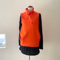 someone's sweat pocket vest