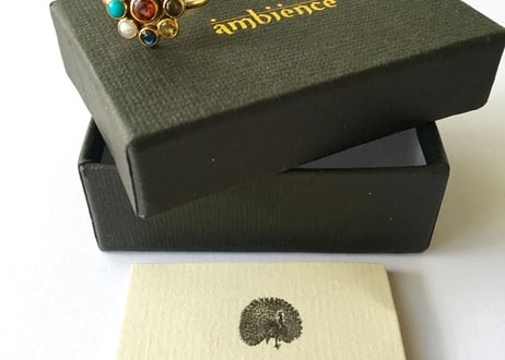 Multi color gems Ring / garnet in center