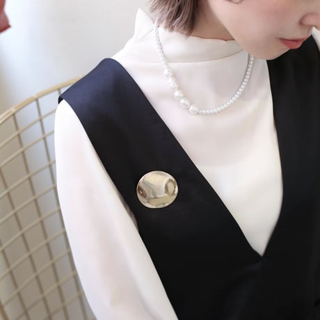 flat metal brooch
