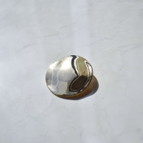 flat metal brooch
