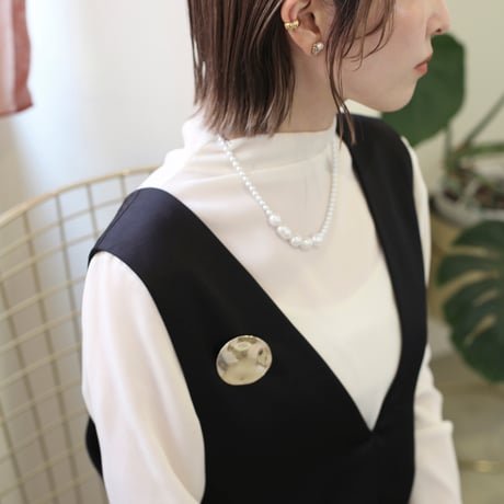 flat metal brooch