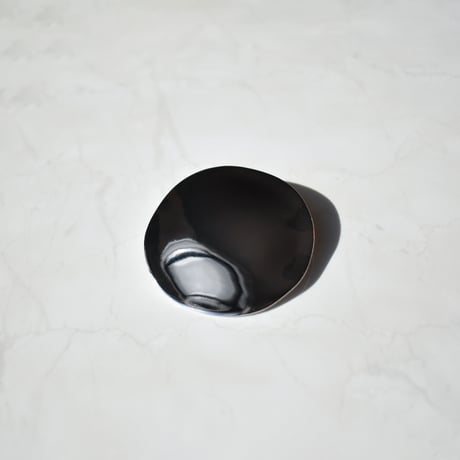 flat metal brooch
